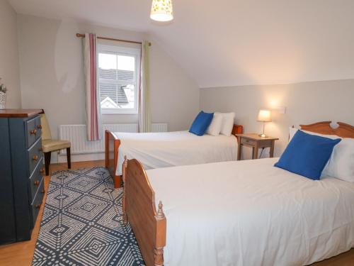 Postel nebo postele na pokoji v ubytování Gooseberry Cottage