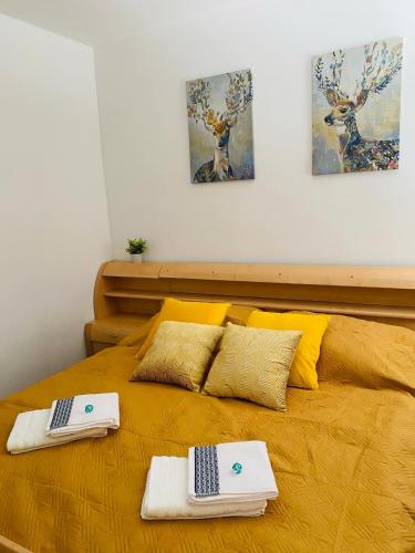 a bed with two towels on top of it at Gasthof Frasswirt in Frass
