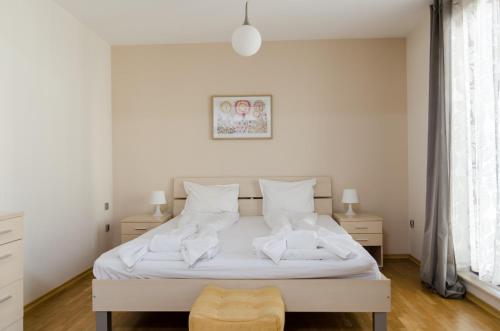 Ένα ή περισσότερα κρεβάτια σε δωμάτιο στο VIP Apartments Sofia