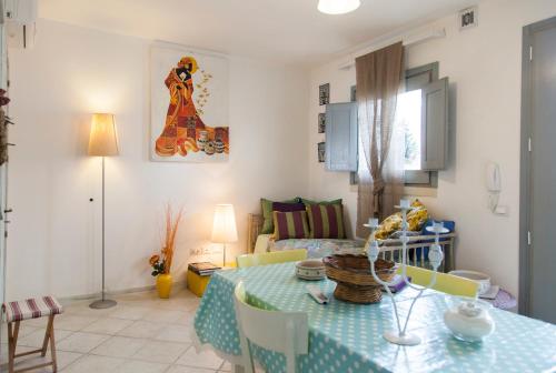 a living room with a table and a couch at Le Terrazze in Otranto