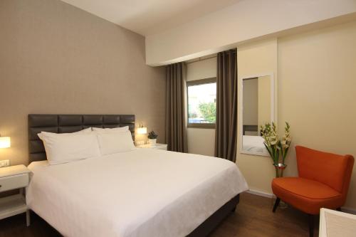 Postel nebo postele na pokoji v ubytování Idelson Hotel