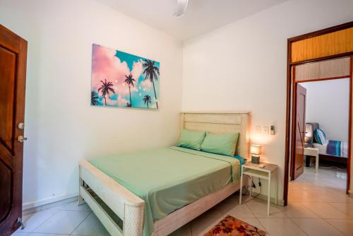 a bedroom with a bed in a room at Casa Estrellas Mirabal in Sosúa