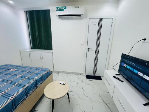 Ein Bett oder Betten in einem Zimmer der Unterkunft CHEZ EL HADJI NGOR