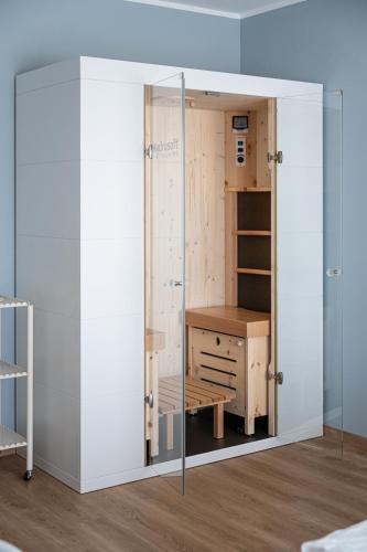 a room with a desk and a glass door at Hotel Trento Alta in Sardagna