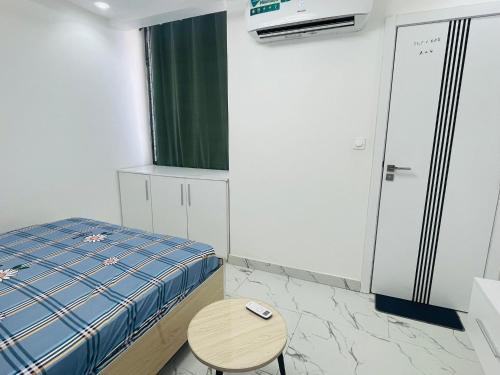 Ein Bett oder Betten in einem Zimmer der Unterkunft CHEZ EL HADJI NGOR