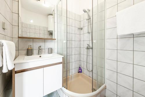 a bathroom with a shower and a sink at Villa Nick in Cavtat