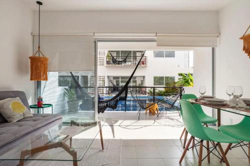a living room with a couch and a table at Papaya Suites Diamante - Adults Only in Acapulco