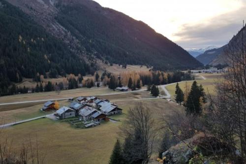 an aerial view of a house in the mountains at Localisation centrale et vue spectaculaire in Champagny-en-Vanoise