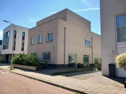 a large brick building on a street at private rooms in luxury villa in The Hague