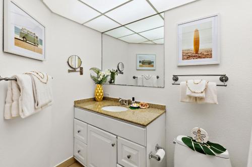 a bathroom with a sink and a mirror at Kaanapali Shores 104 in Kahana