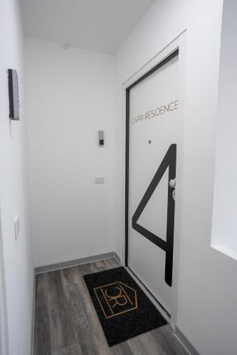 a door in a room with a mat in front of it at Capri Residence in Casoria