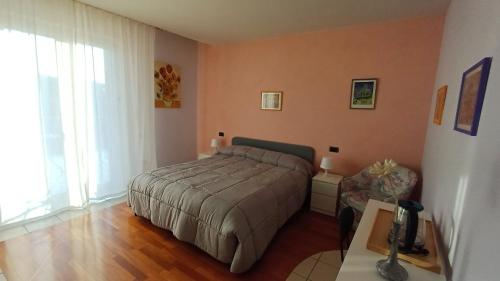 Ένα ή περισσότερα κρεβάτια σε δωμάτιο στο A casa di Geri