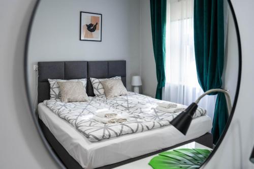 Postel nebo postele na pokoji v ubytování Wąska 5 Apartamenty