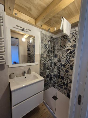 a bathroom with a sink and a shower at Loft piano terra a 300m dal mare in Terracina