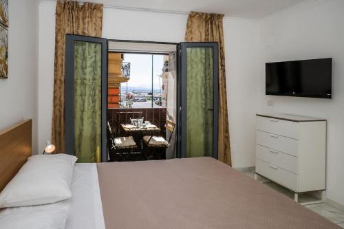 Ένα ή περισσότερα κρεβάτια σε δωμάτιο στο Casa Alfredo Mergellina Sea&City