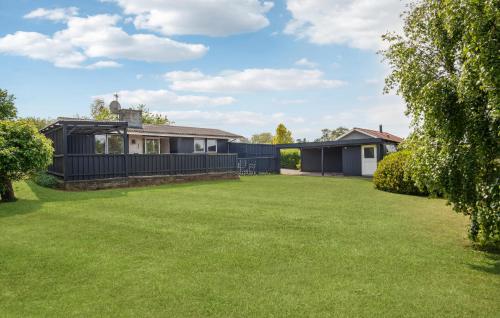 a house with a large lawn in front of it at 3 Bedroom Nice Home In Slagelse in Slagelse