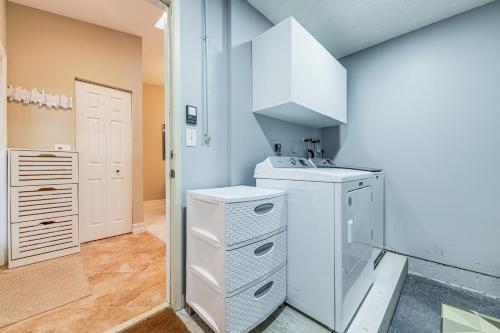 a white laundry room with a washer and dryer at Riverfront Backyard and Grill Sunrise Family Home in Sunrise