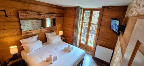 Postel nebo postele na pokoji v ubytování Hotel l'Escapade