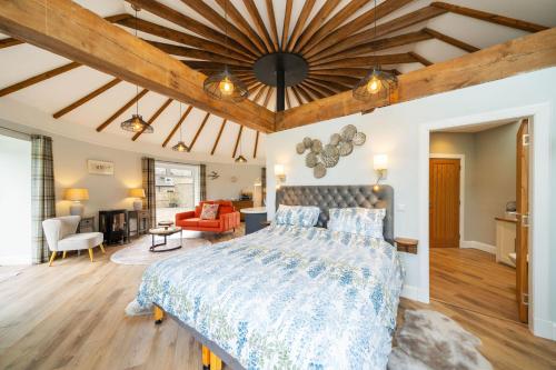 a bedroom with a bed and a living room at The Roundhouse in Dunkeld