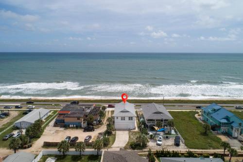 an aerial view of a house with a red cross on top at Wave Runner in Flagler Beach