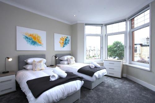 Ένα ή περισσότερα κρεβάτια σε δωμάτιο στο Three Bedroom Upper Flat in Jordanhill