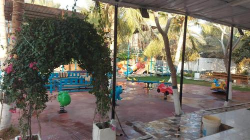 a view of a playground with a park at Al Dhalal Farm Villa in Muscat