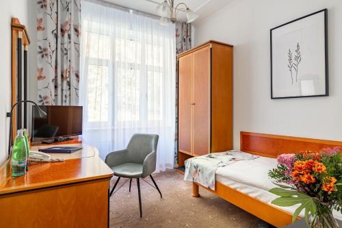 Postel nebo postele na pokoji v ubytování Spa & Wellness Hotel Silva