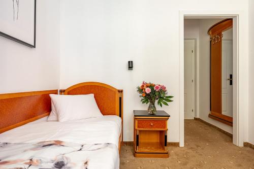 Postel nebo postele na pokoji v ubytování Spa & Wellness Hotel Silva