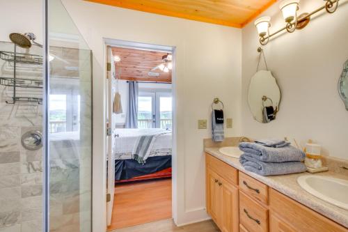 a bathroom with a shower and a sink at Lakemont Mountain Cabin with Game Room and Hot Tub! in Lakemont
