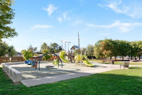 a playground with a slide in a park at Iola in Aurora