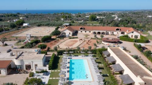 an aerial view of a resort with a swimming pool at Delle Rose Horses Club in Torre Vado