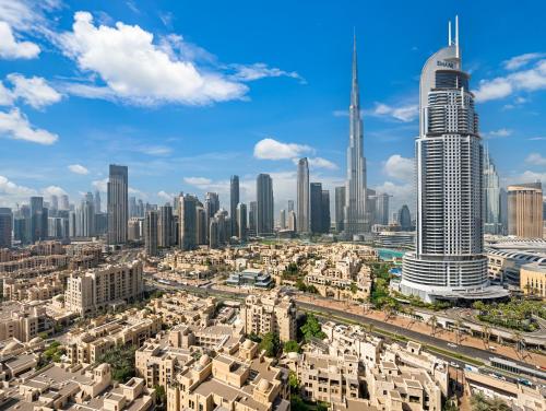 an aerial view of a city with skyscrapers at SmartStay at Burj Royale - Full Burj Khalifa View - Brand New Luxury Apartments in Dubai