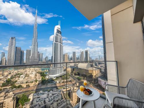 a room with a view of a city skyline at SmartStay at Burj Royale - Full Burj Khalifa View - Brand New Luxury Apartments in Dubai