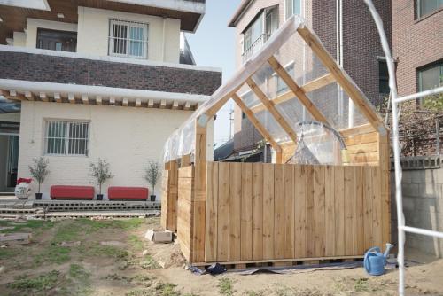 a wooden fence in front of a house at Wonju Aunt Home in Wonju