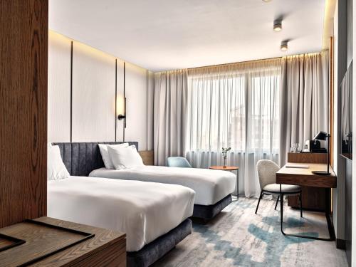 Postel nebo postele na pokoji v ubytování Crowne Plaza Sofia by IHG
