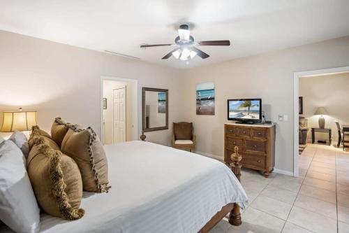 a bedroom with a bed and a ceiling fan at Ground-Floor Unit in Front of Lazy River Pool at Pacifico in Coco in Coco