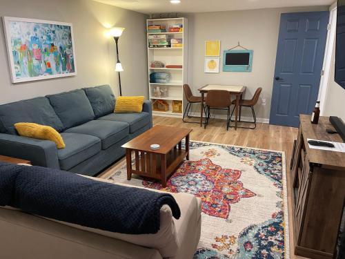 a living room with a couch and a table at Near downtown with hot tub sleeps seven in Blacksburg