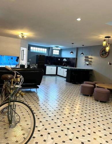 a living room with a bike parked in a room at Villa Patong Beach in Patong Beach