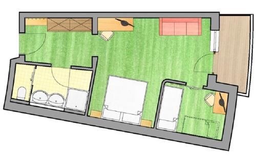 a floor plan of a house at Heidi-Hotel Falkertsee - Kinderhotel in Patergassen
