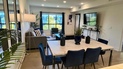 a dining room and living room with a table and chairs at Century City Cozy 3 Bedroom Apartment with Parking 302,303 in Los Angeles