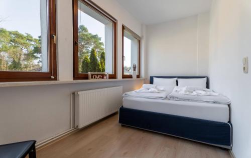 Katil atau katil-katil dalam bilik di Ostseebad-Karlshagen-geraeumige-Ferienwohnung-Herbst