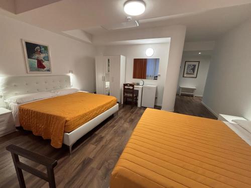 a bedroom with a bed and a desk in it at Victoria Royal Garden in Como