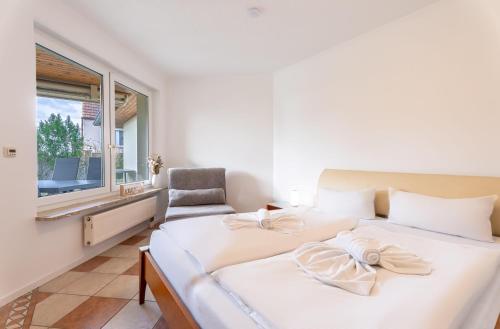 Katil atau katil-katil dalam bilik di Bernsteinbad-Koserow-Haus-Fuenf-Elemente-Ferienwohnung-Luft