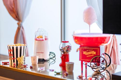 a counter with a red blender and other items on it at Il Était Une Fois - GAP Chambre romantique & SPA in Gap