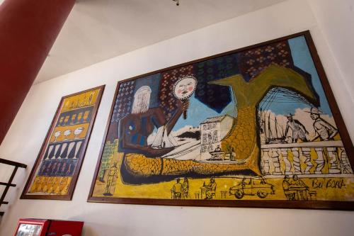 a large painting on the wall of a building at Rede Andrade Mar Hotel - Rio Vermelho in Salvador