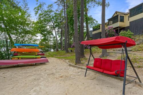a group of inflatables sitting in the sand at Moose Manor- Squam Waterfront in Holderness