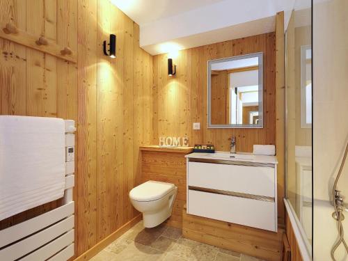 a bathroom with a toilet and a sink and a mirror at Appartement rénové proche des pistes - 4 pers, balcon, casier à skis - FR-1-575-211 in Courchevel