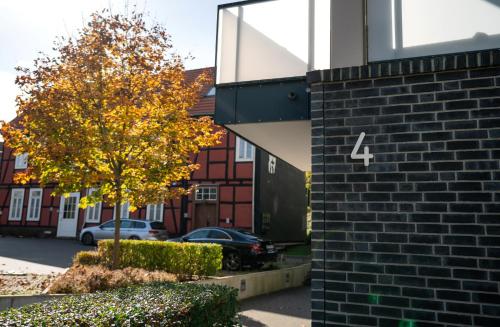 a building with a sign on the side of it at REITZ - Apartment I Zentrale Lage I Stellplatz I 55qm I 2 Zimmer I Küche I Bad I Terrasse in Bad Hersfeld