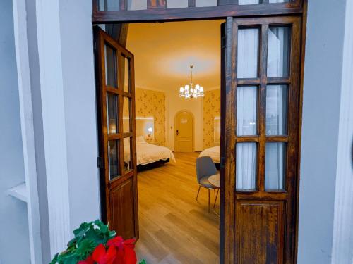 an open door to a room with a bedroom at Hotel Sucre in Quito
