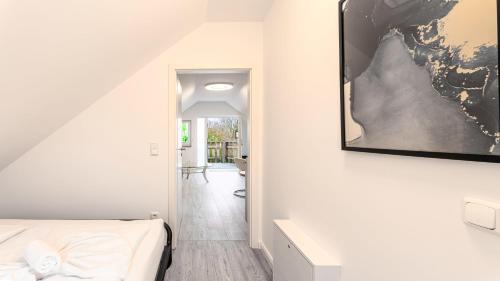 Postel nebo postele na pokoji v ubytování Ostseebad-Zinnowitz-Kuschelige-Ferienwohnung-Wolken